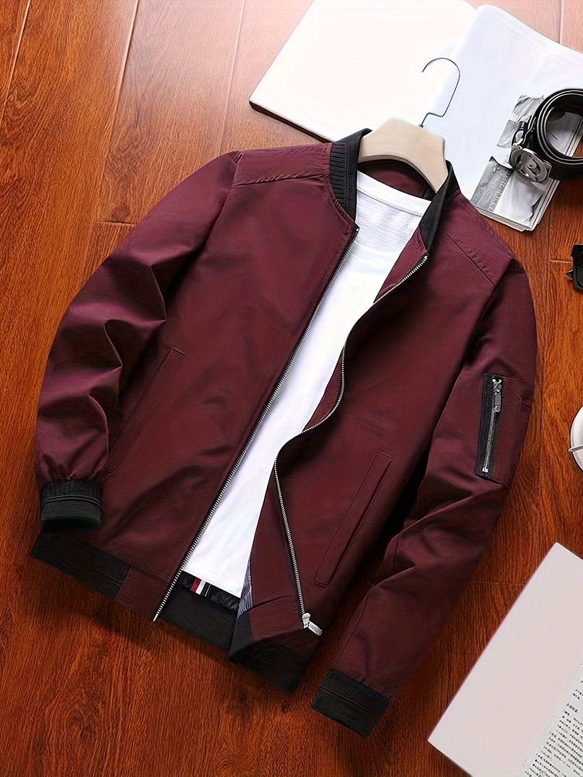 Classic bomber jacket presented in a relaxed everyday outfit setting.