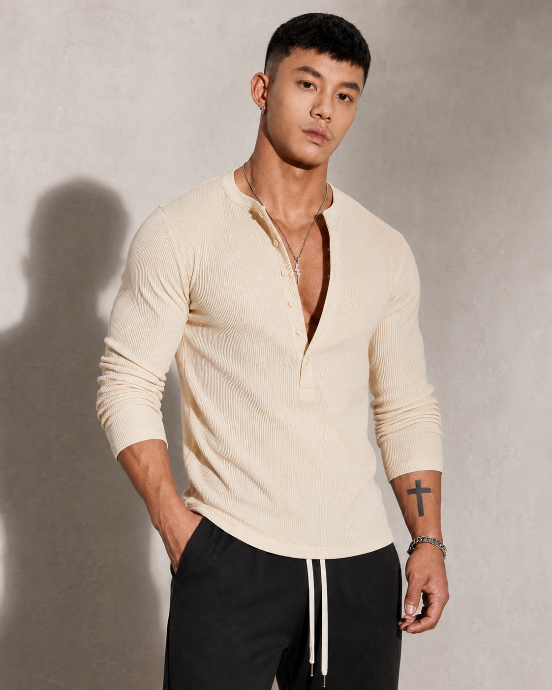 Ribbed knit long-sleeve sweater with a half-button neckline
