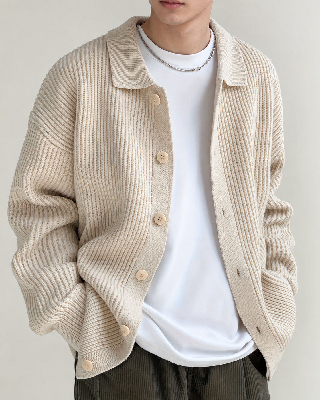 Detailed view of the cardigan's ribbed fabric