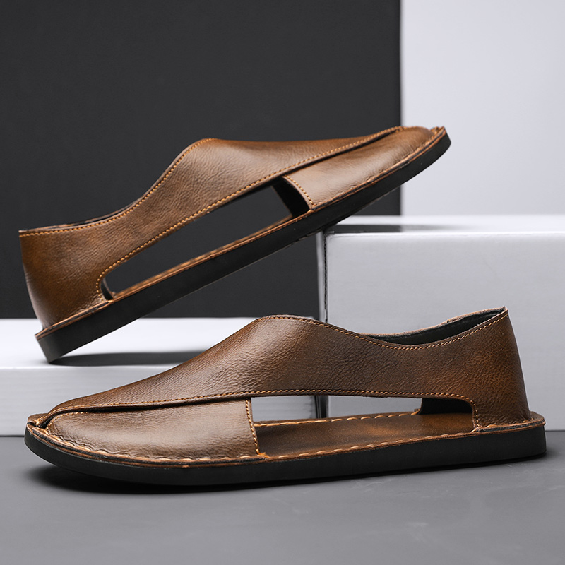 Close-up of the crossover leather straps on flat sandals