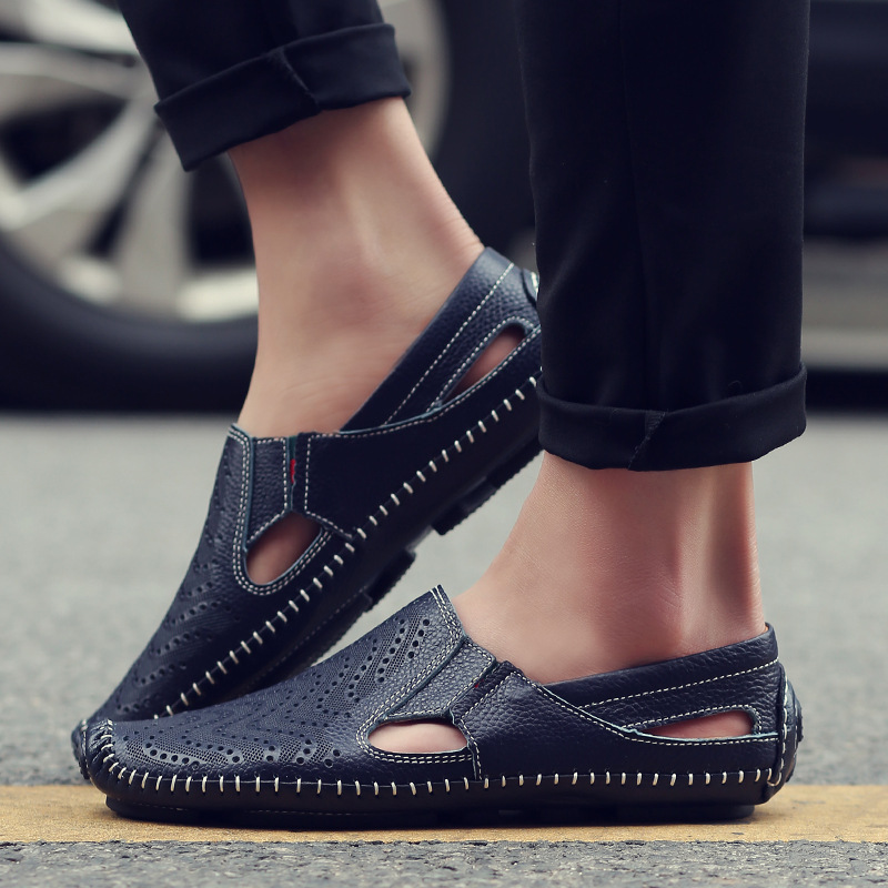 Pair of perforated leather strap sandals viewed from above