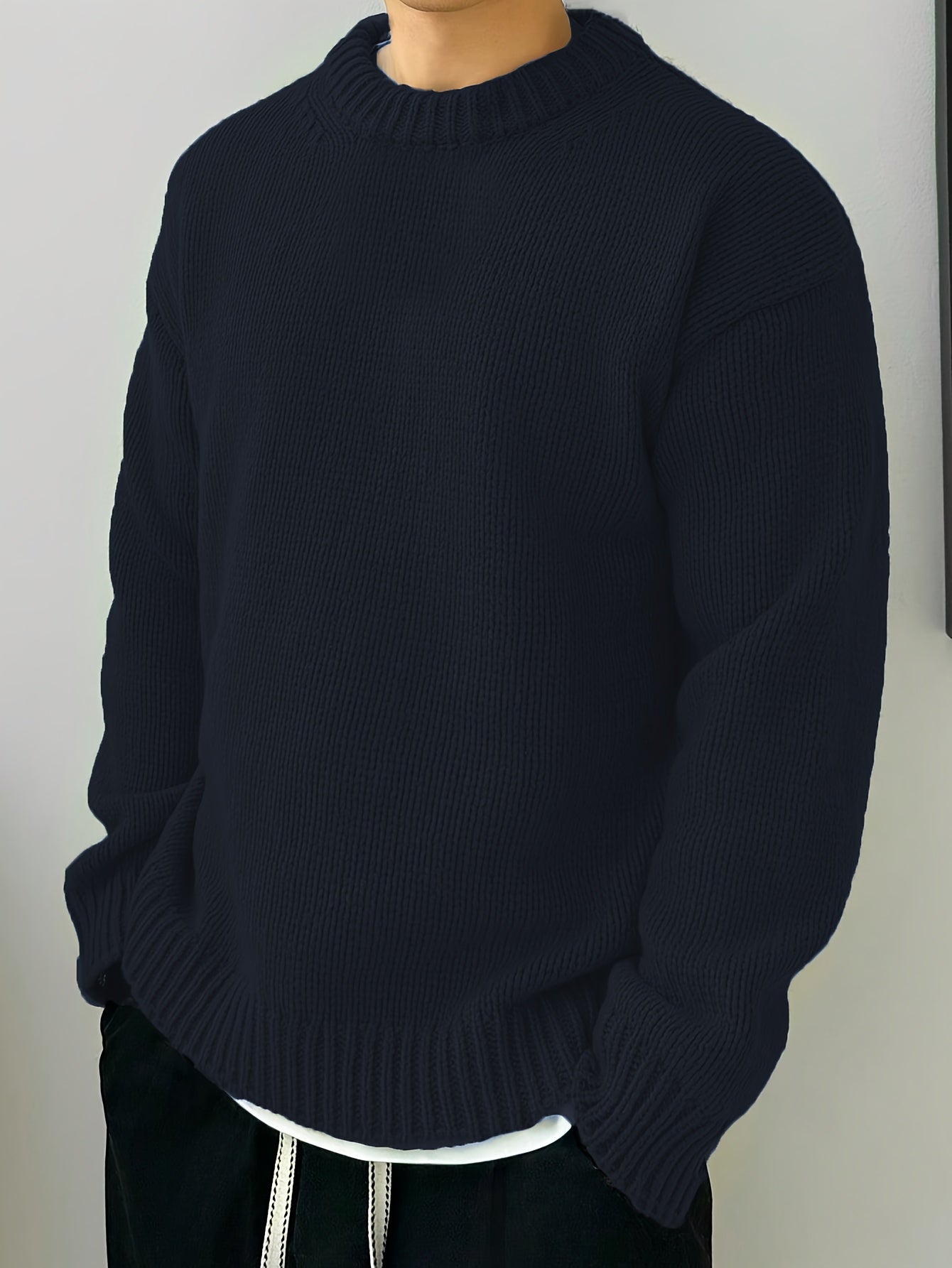 Textured pullover sweater showing ribbed neckline