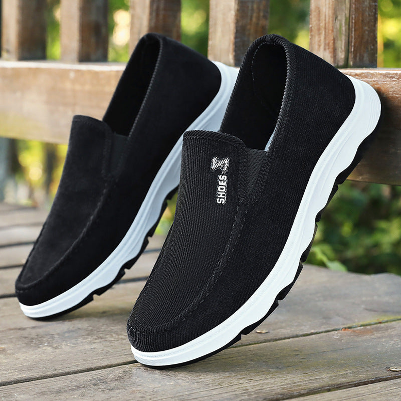 Pair of men's casual slip-on shoes with breathable textile construction