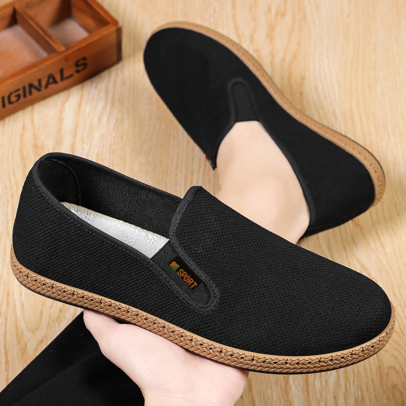 Side view of men's knit slip-on casual shoes with a flexible sole