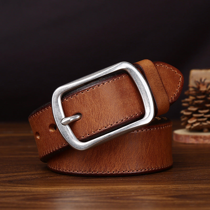Close-up view of the men's belt showing its classic buckle