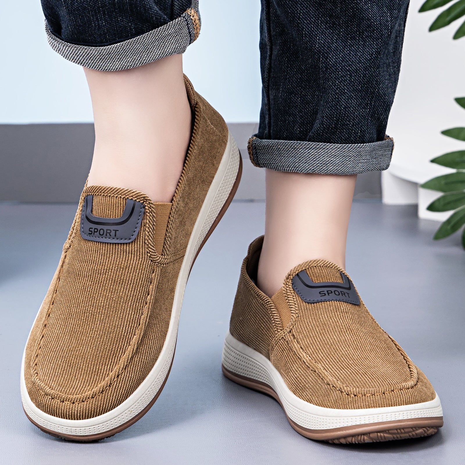 Side view of men's corduroy sneakers with an elastic slip-on entry