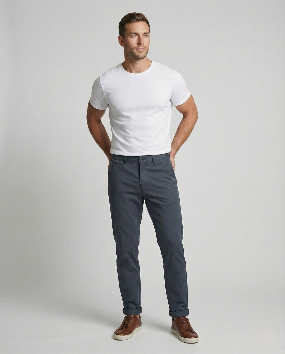 Men's tapered chino pants showing the slim leg silhouette