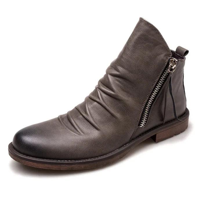 Men's leather boots displayed together to show their classic shape