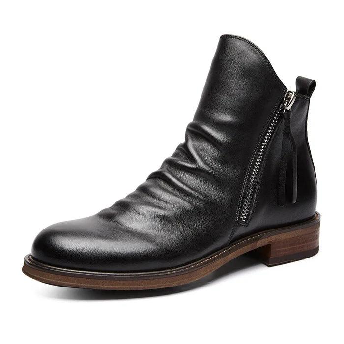 Pair of men's leather boots with sturdy soles and a timeless design