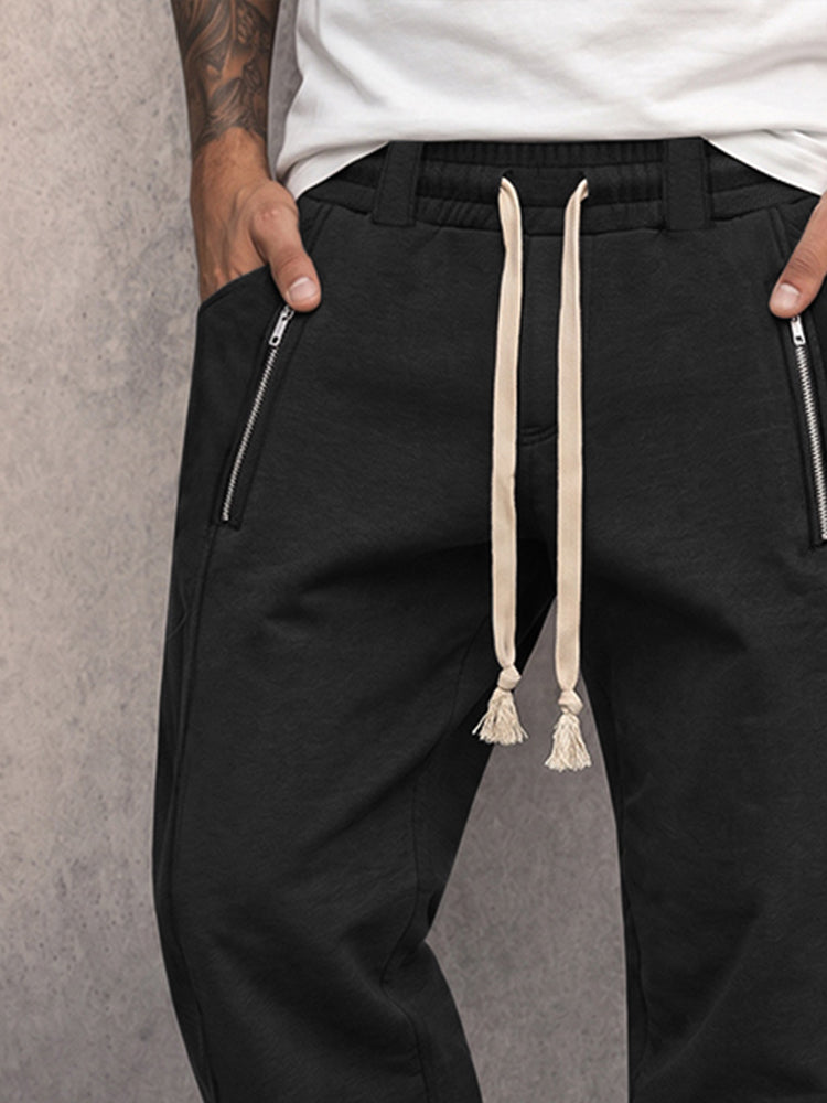 Side view of versatile sweatpants with zipper details