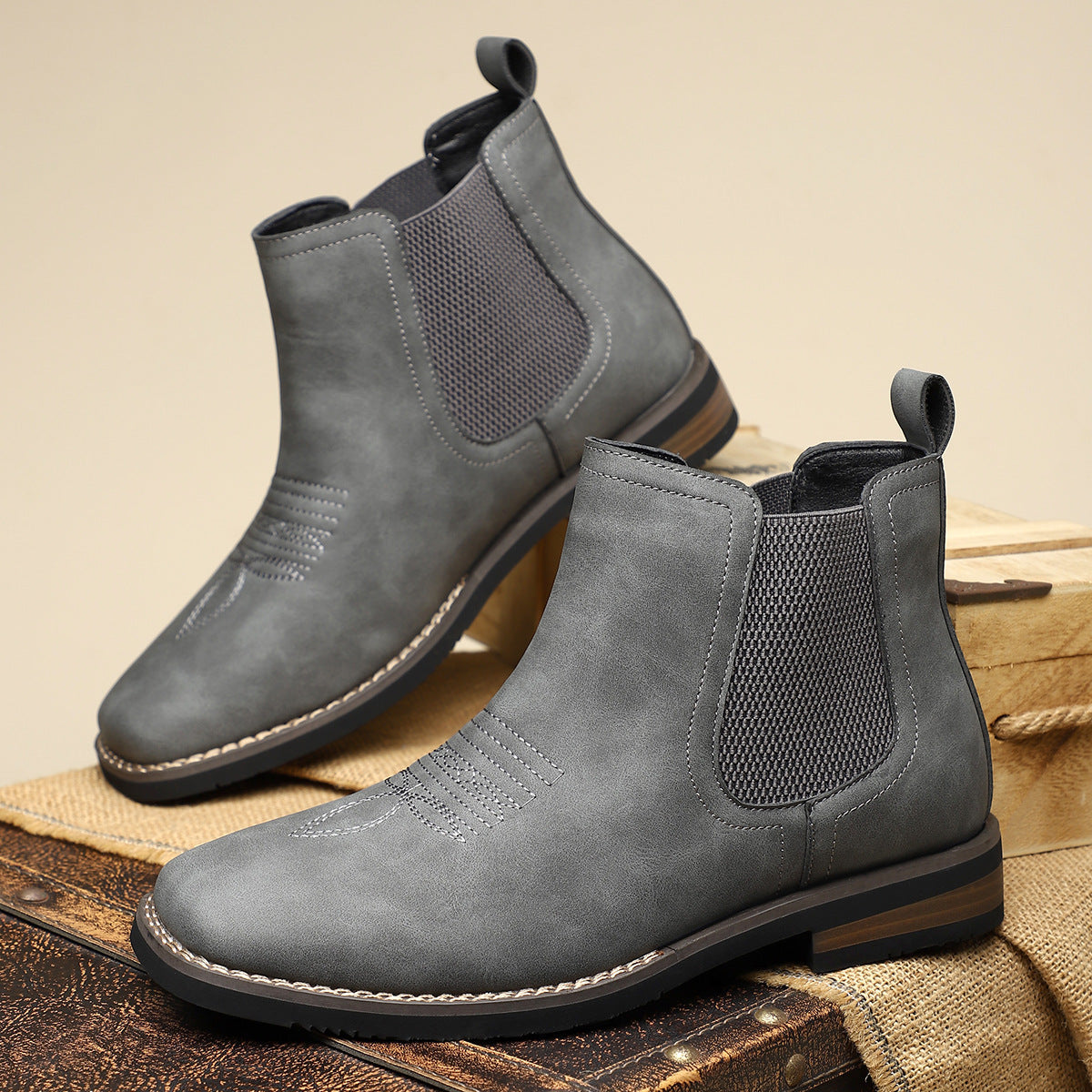 Pair of men's leather boots displayed at an angle