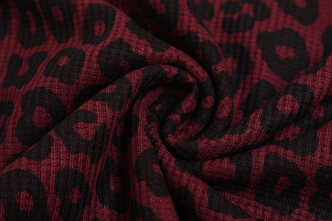 Detailed view of sleeve embroidery on a women's sweatshirt