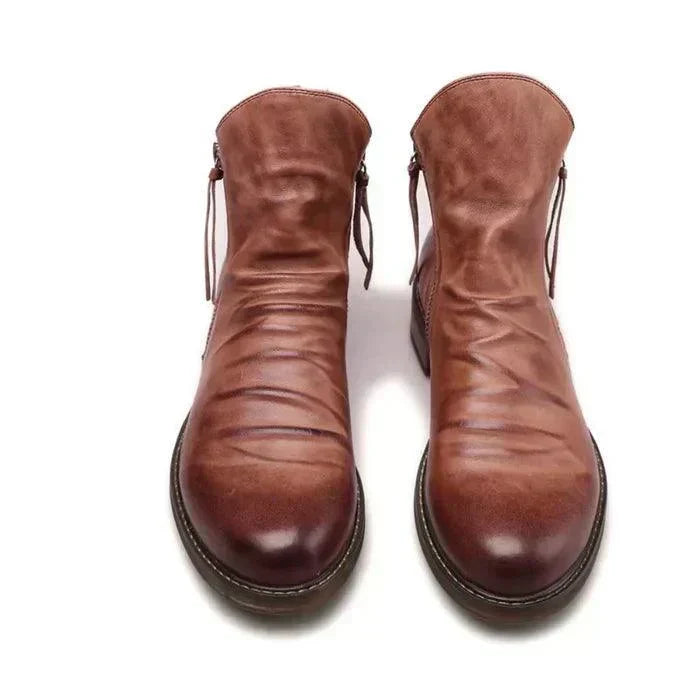 Pair of classic men's leather boots styled for casual weekend wear