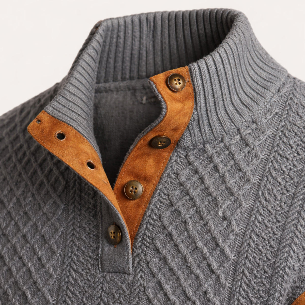 Button-front cardigan displaying its classic cable-knit pattern
