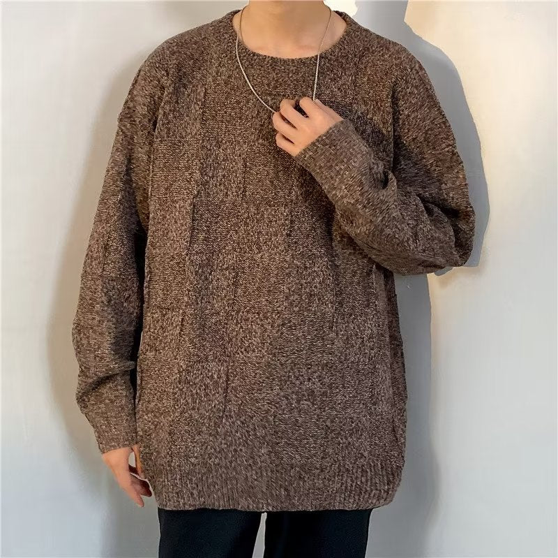 Side view of a men's diamond pattern sweater with long sleeves