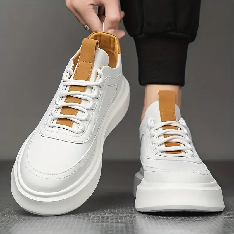 Pair of leather everyday sneakers shown from above