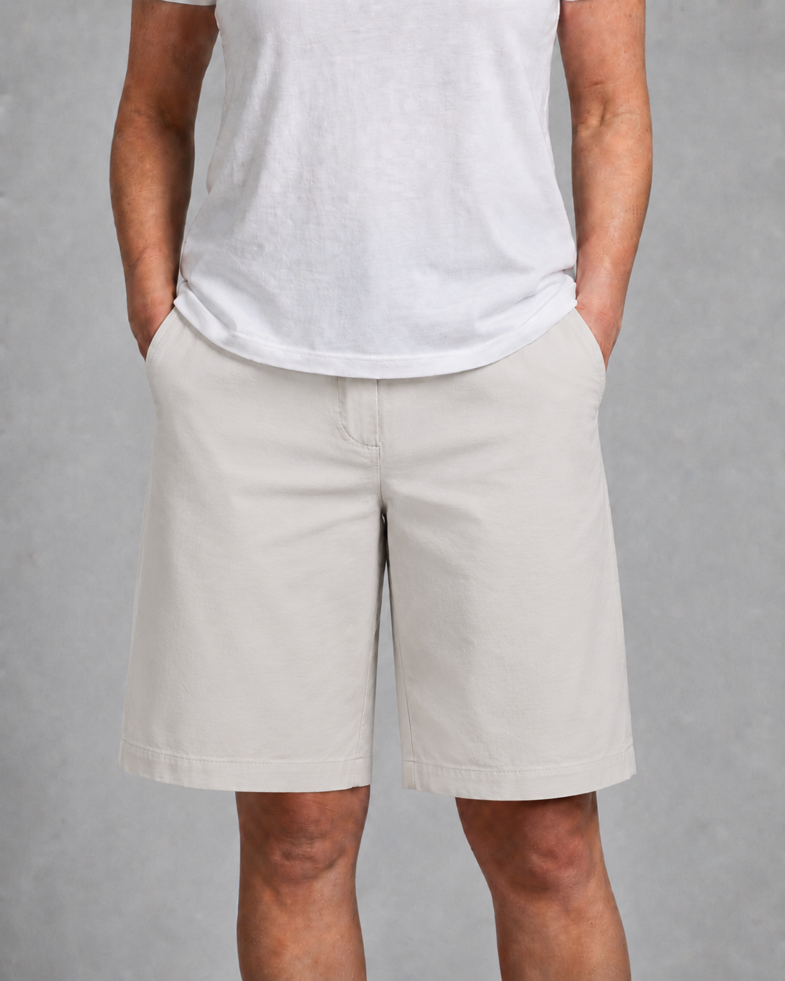 Side view of women's mid-rise wide-leg knee-length shorts