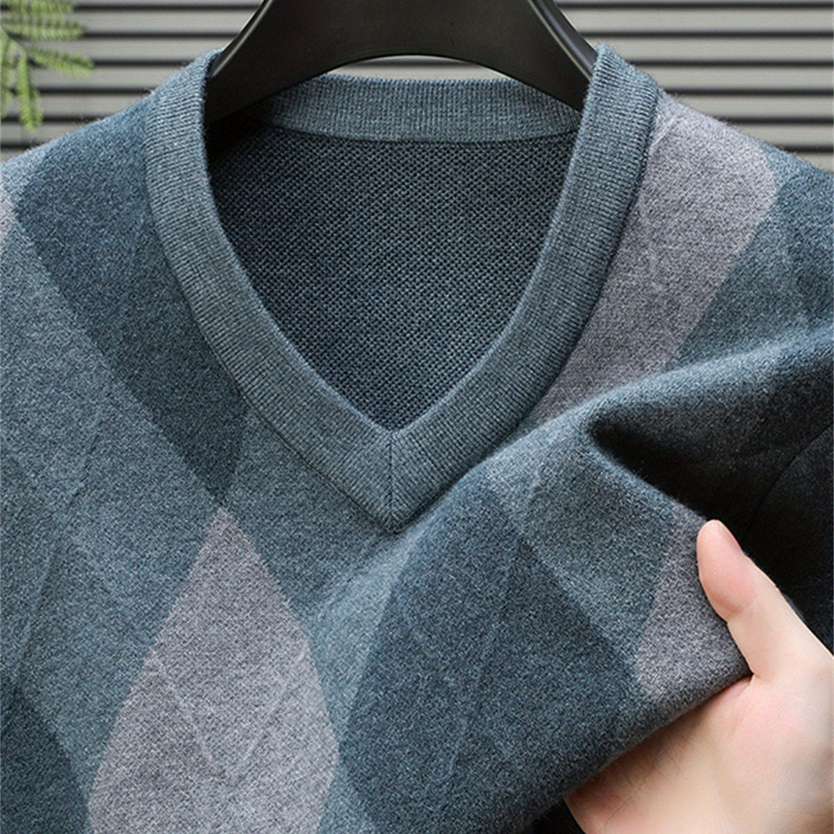 Back view of the men's argyle V-neck sweater