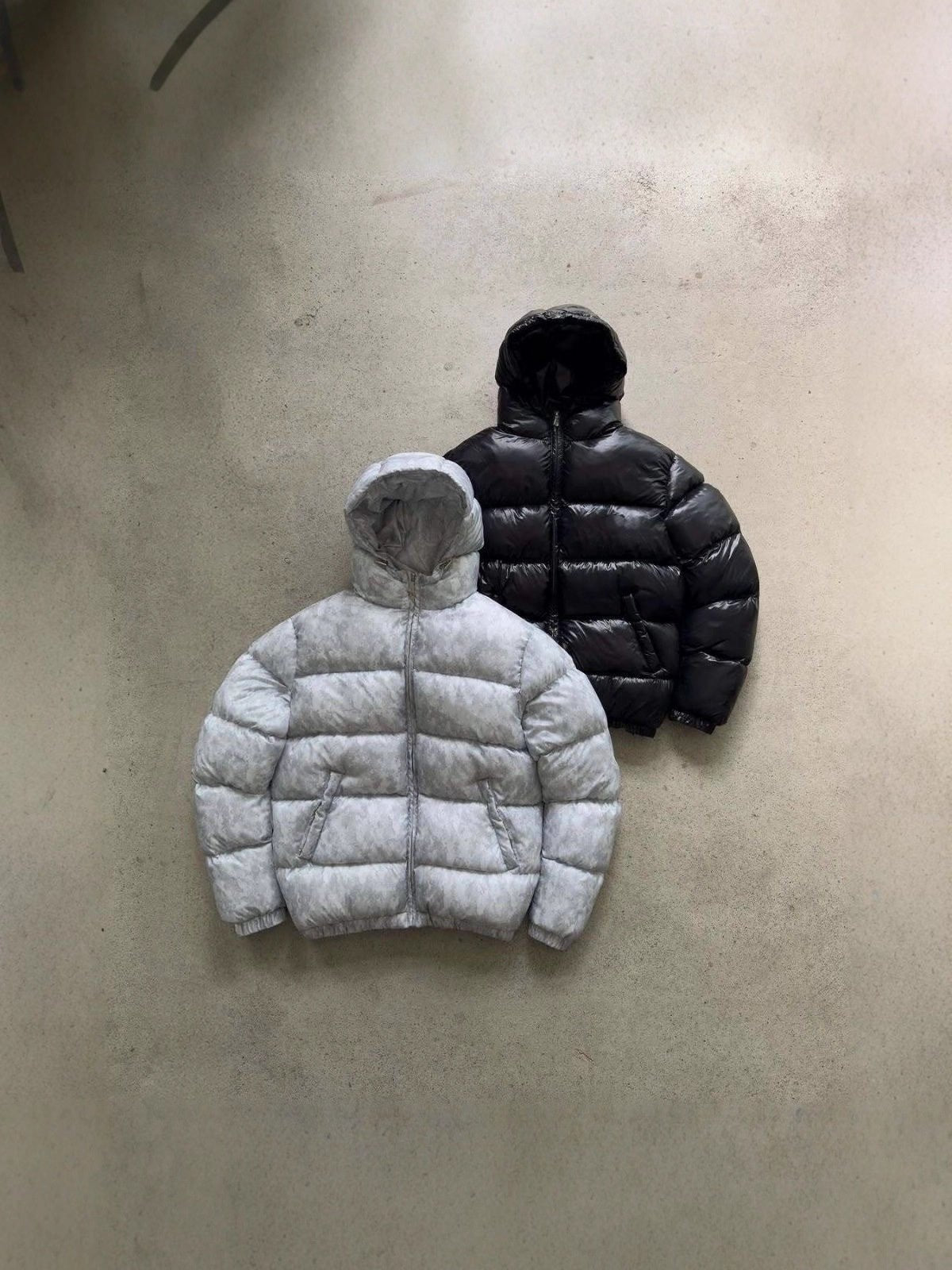 Men's puffer jacket shown with the hood raised