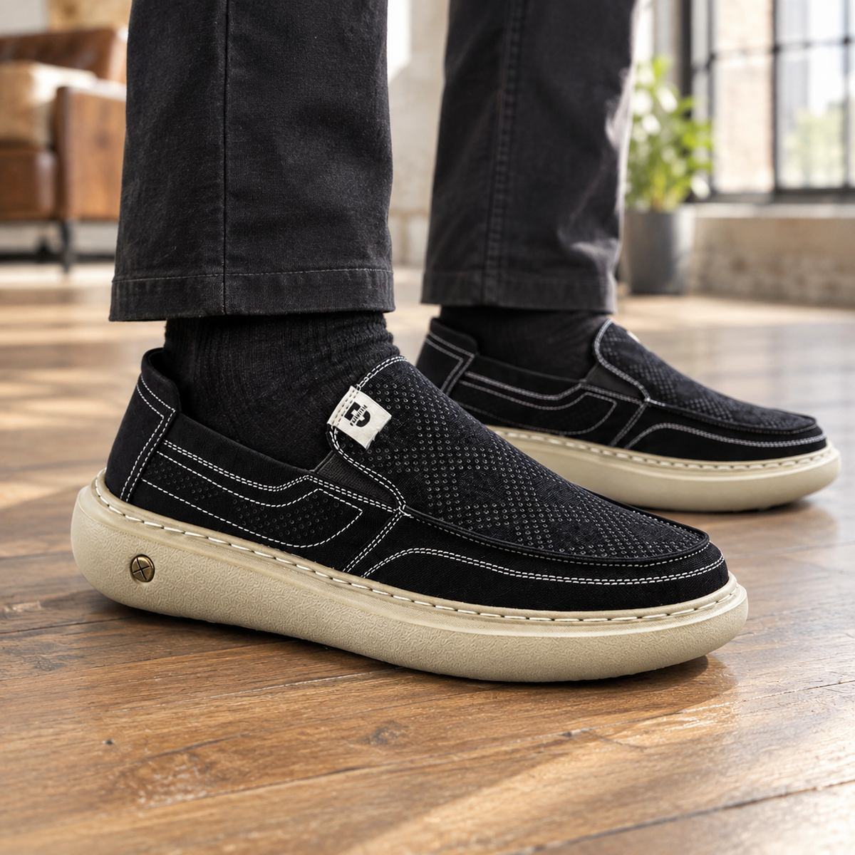 Perforated slip-on loafer showing the breathable upper and cushioned sole
