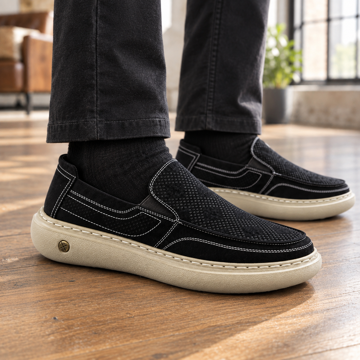 Side view of a perforated men's slip-on loafer with a flexible profile