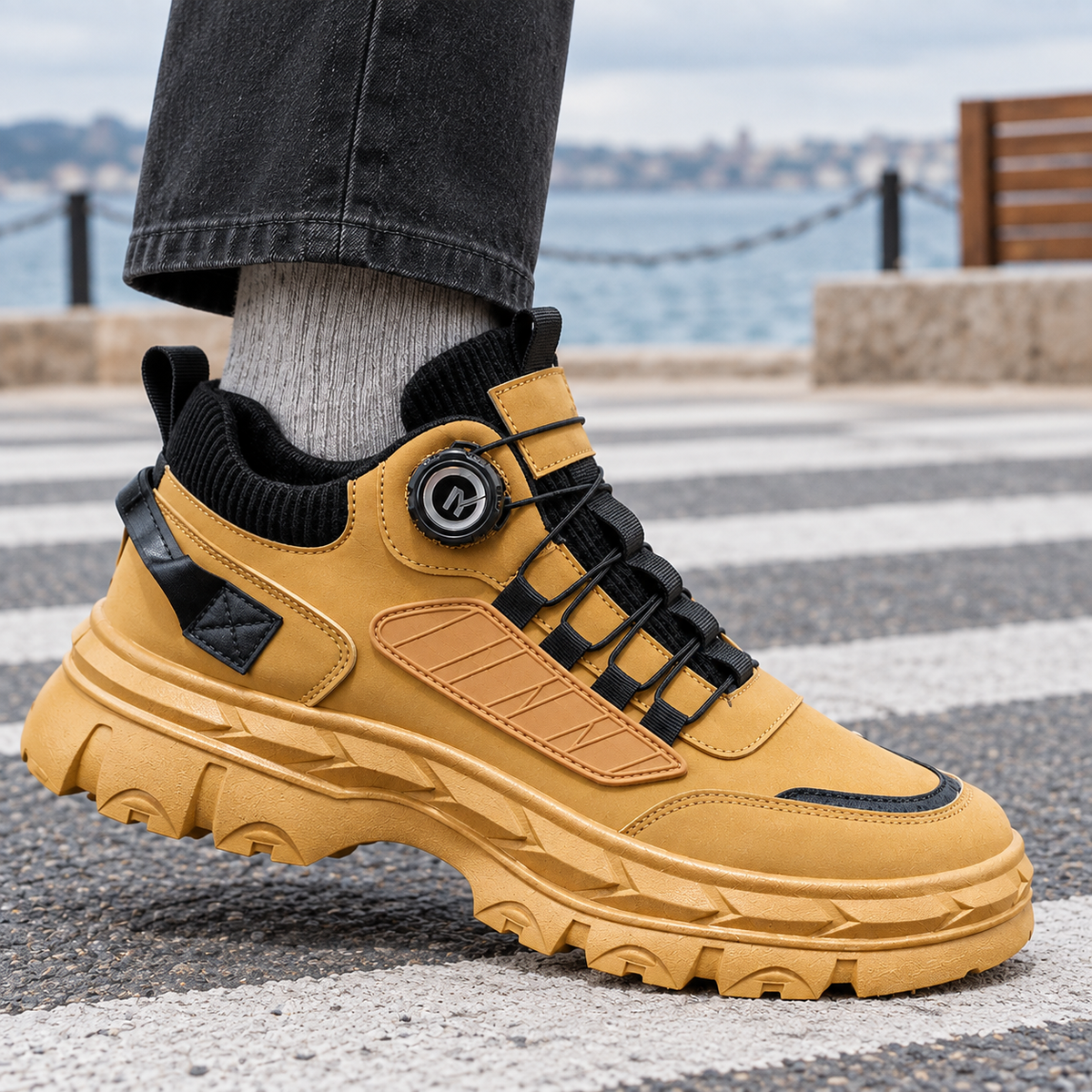 Side view of chunky platform sneakers with a leather look finish