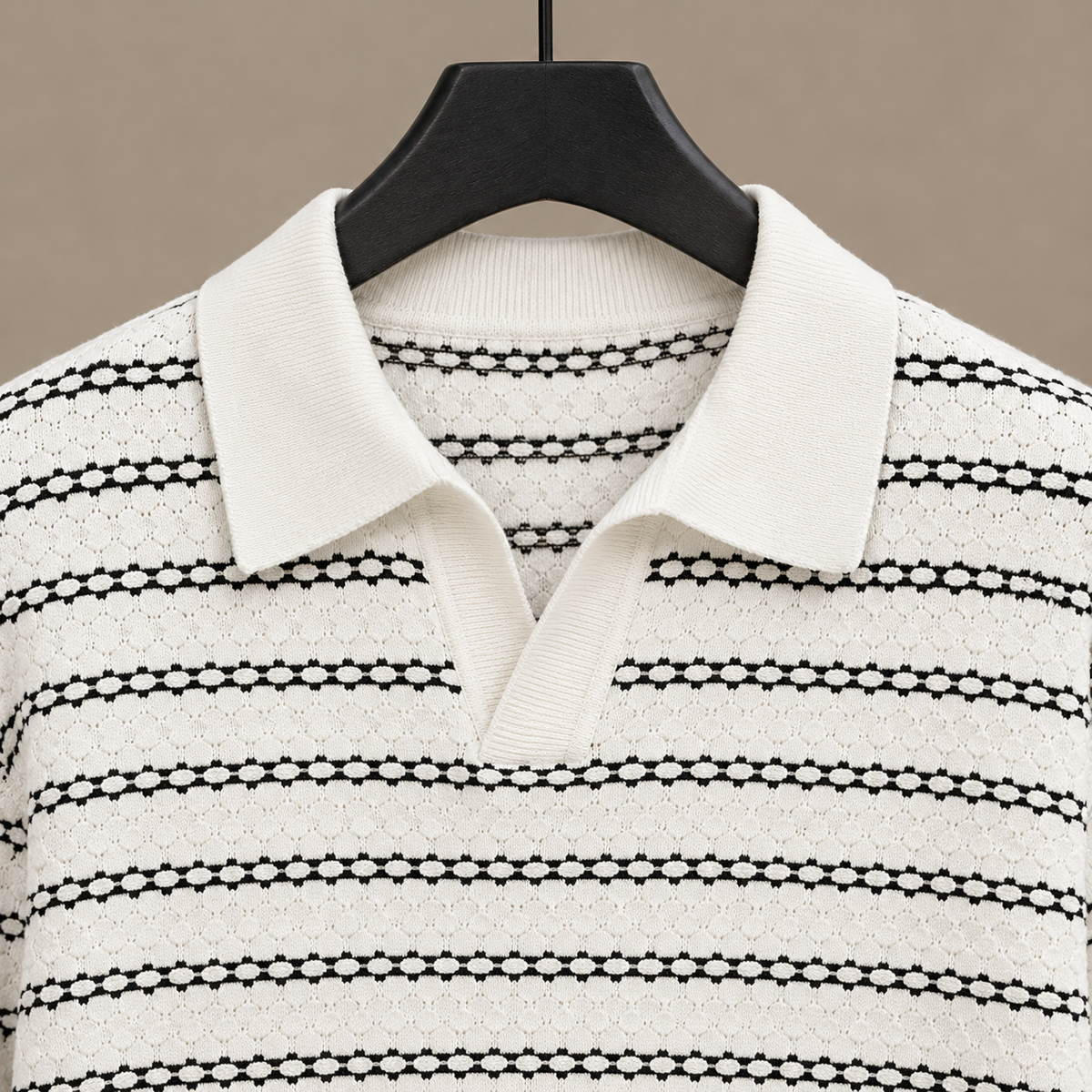 Men's knit polo shirt showing the relaxed open collar design