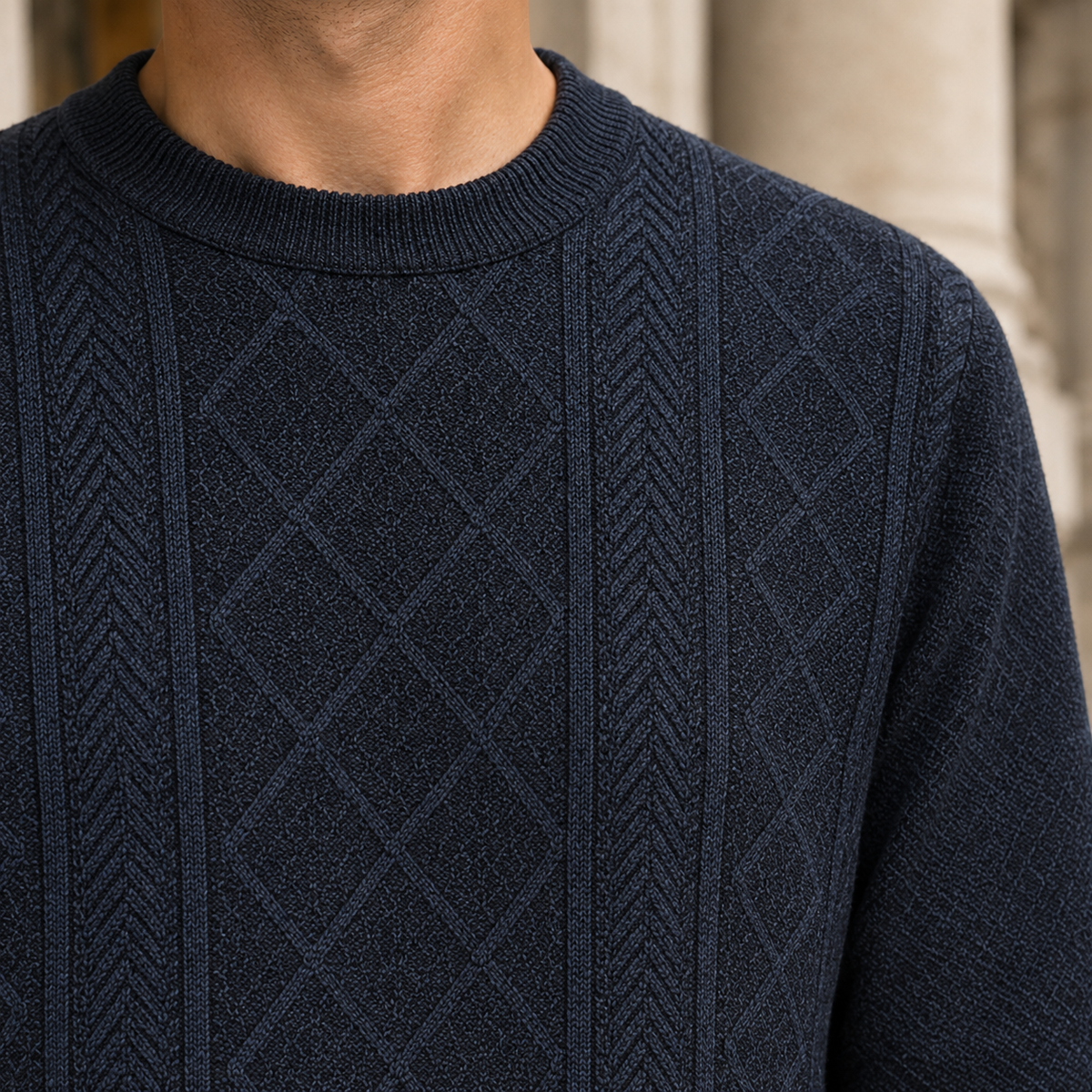 Close-up view of the sweater's textured knit pattern