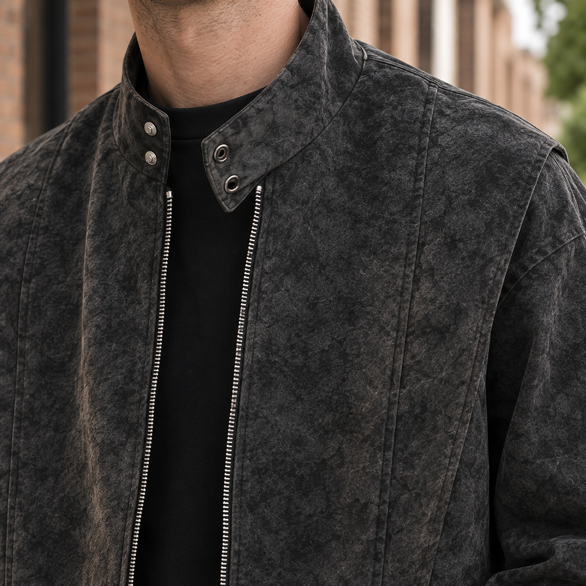 Close-up of the brushed fabric and stand collar on a men's jacket