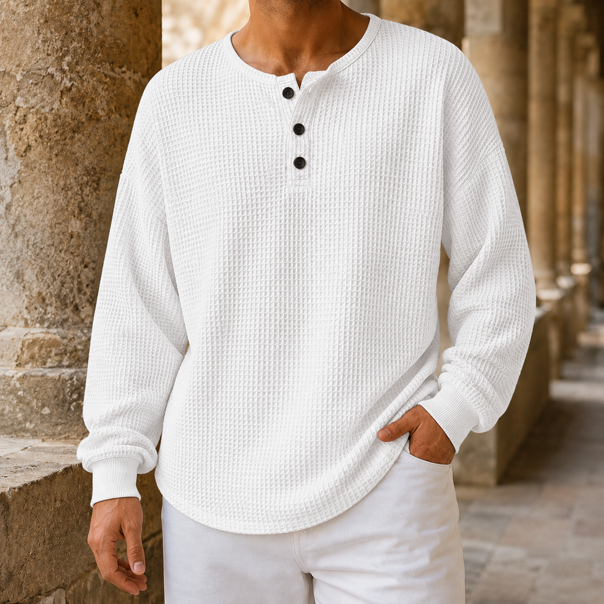 Side view showing the relaxed shape of the Henley sweater