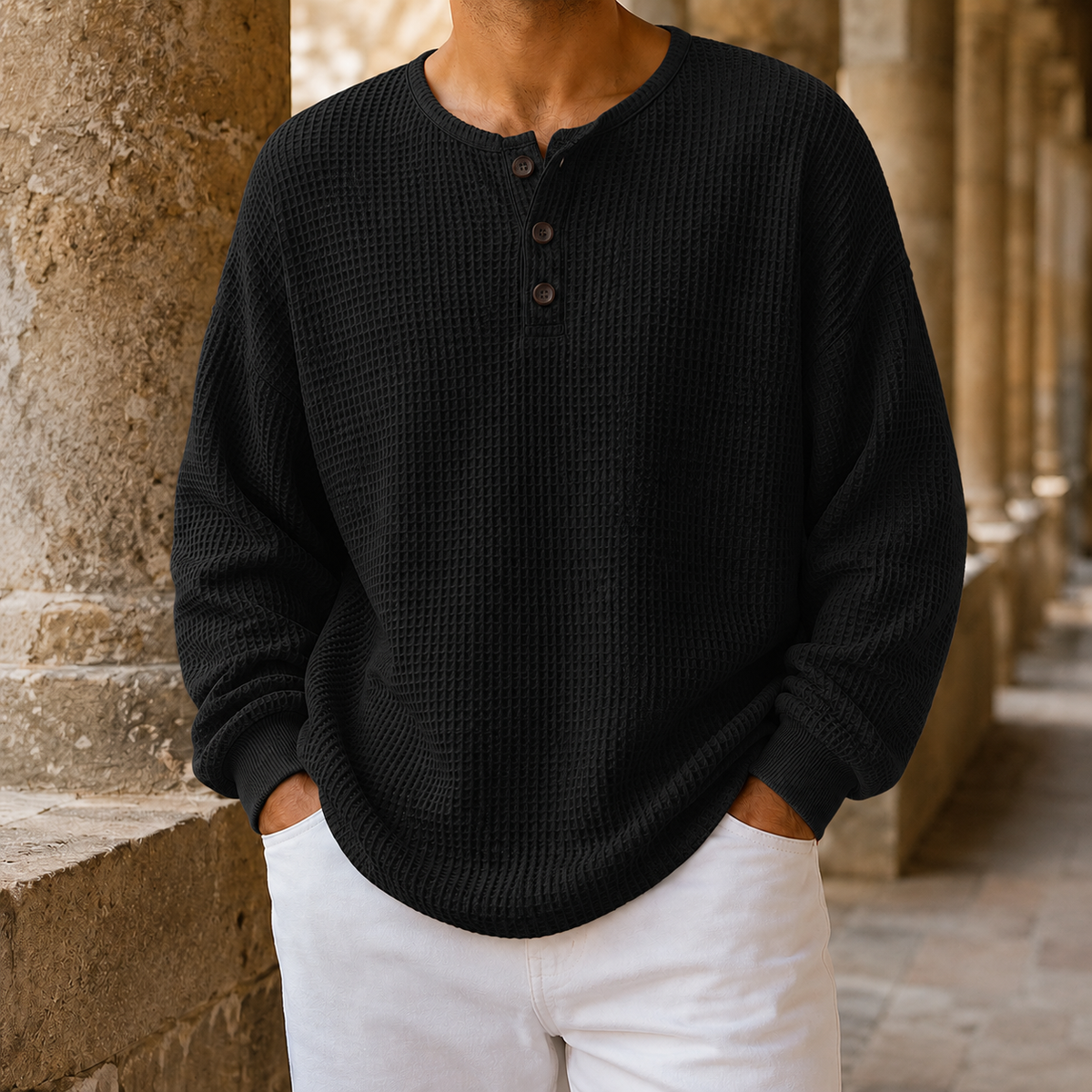 Detail of the Henley neckline and button closure