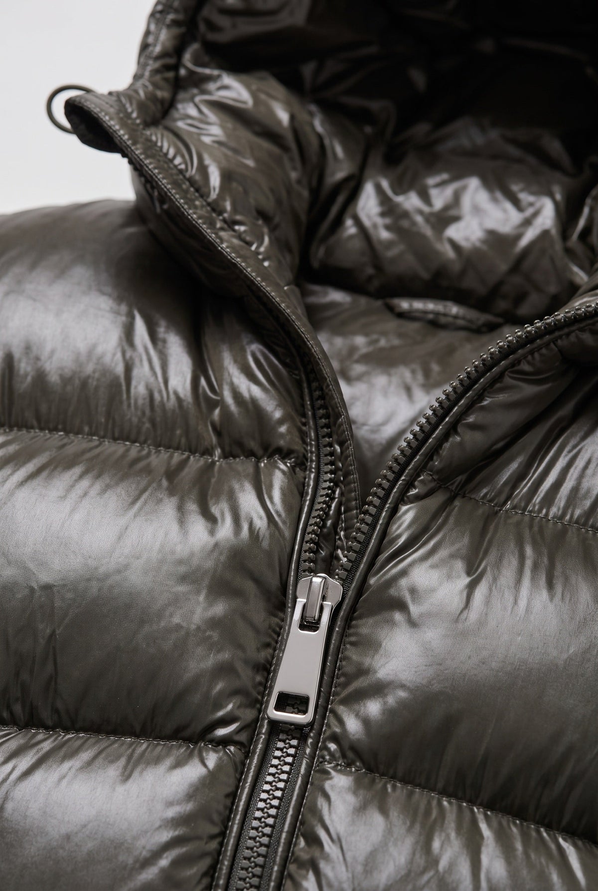 Side view of a men's quilted winter jacket with hood