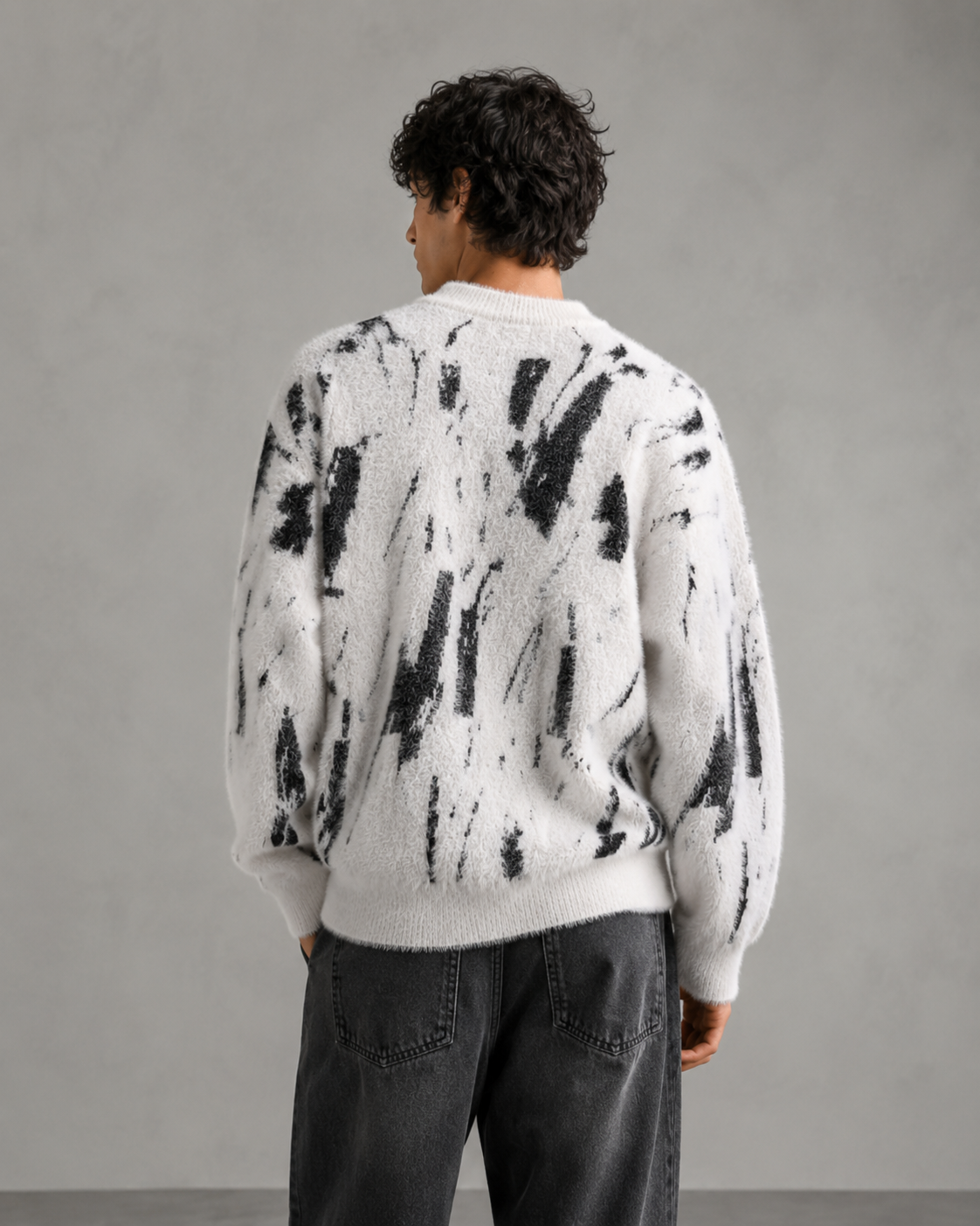 Front view of a men's abstract knit sweater with soft fuzzy texture