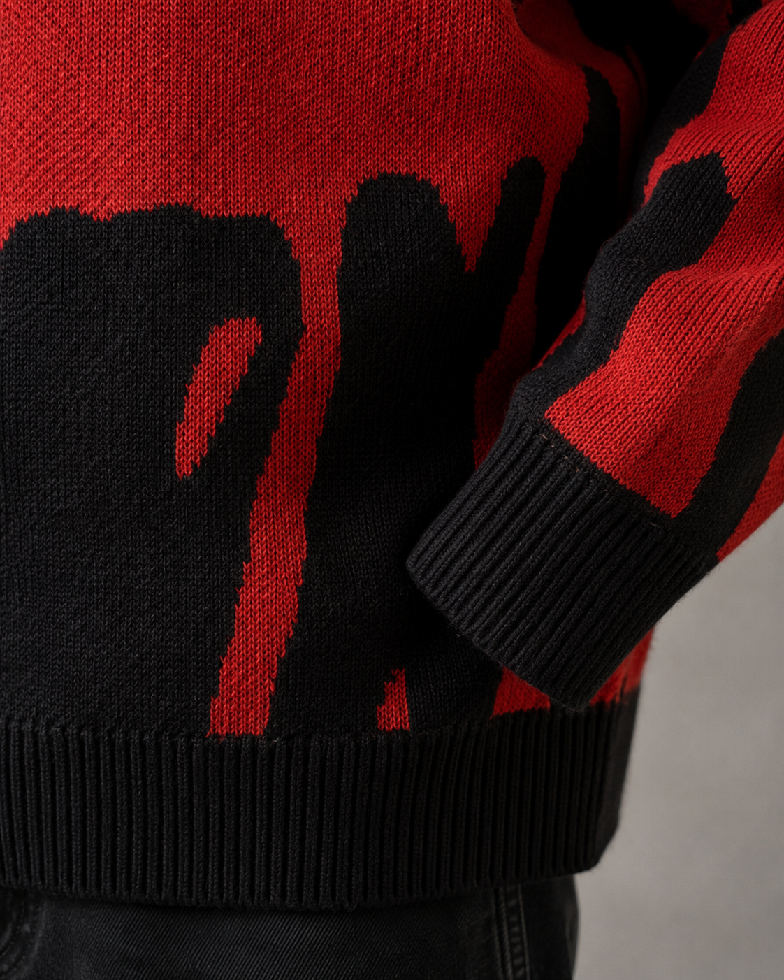 Men's relaxed-fit knit sweater styled for a casual streetwear look