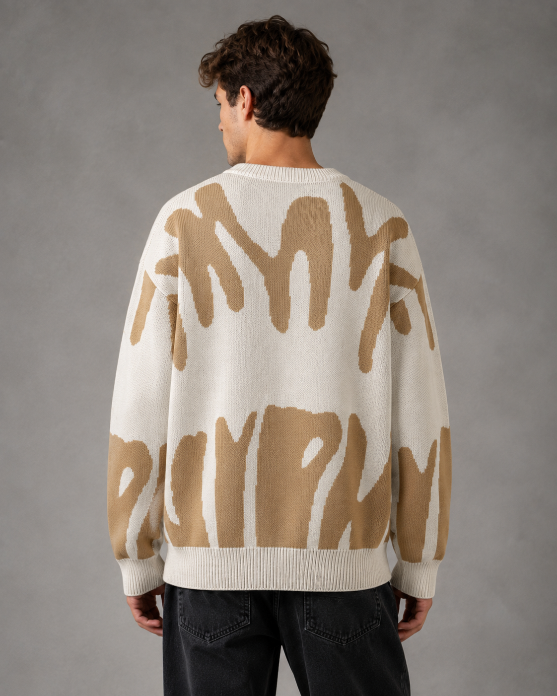 Close-up view of the abstract knit texture on a men's sweater
