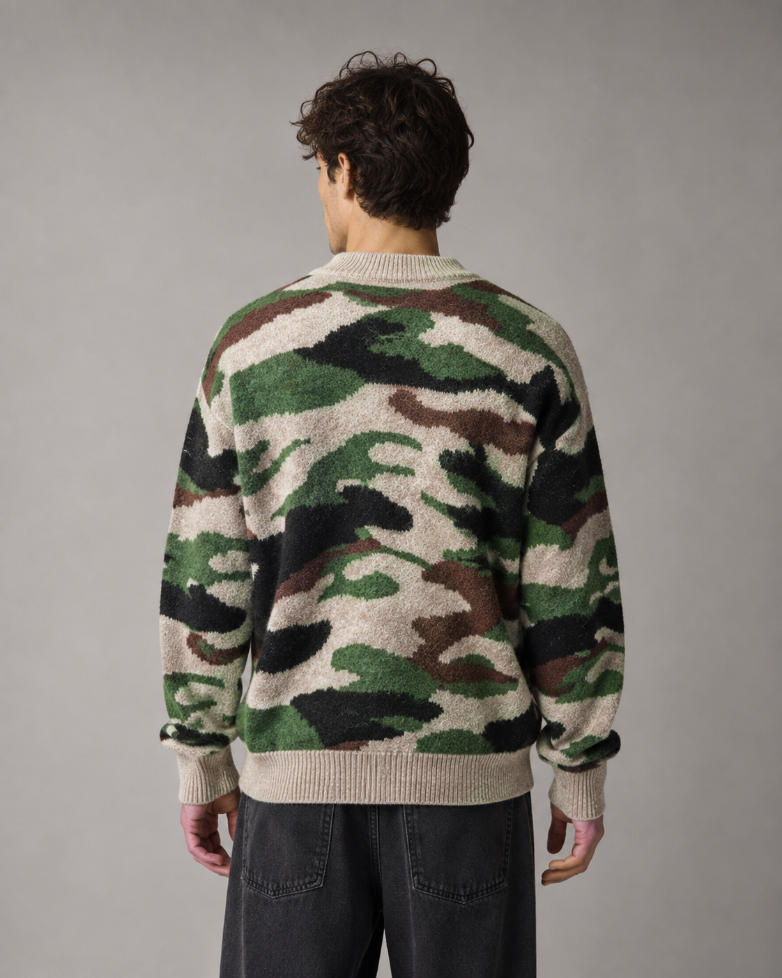 Men's camo knit sweater showing the relaxed crew neck design