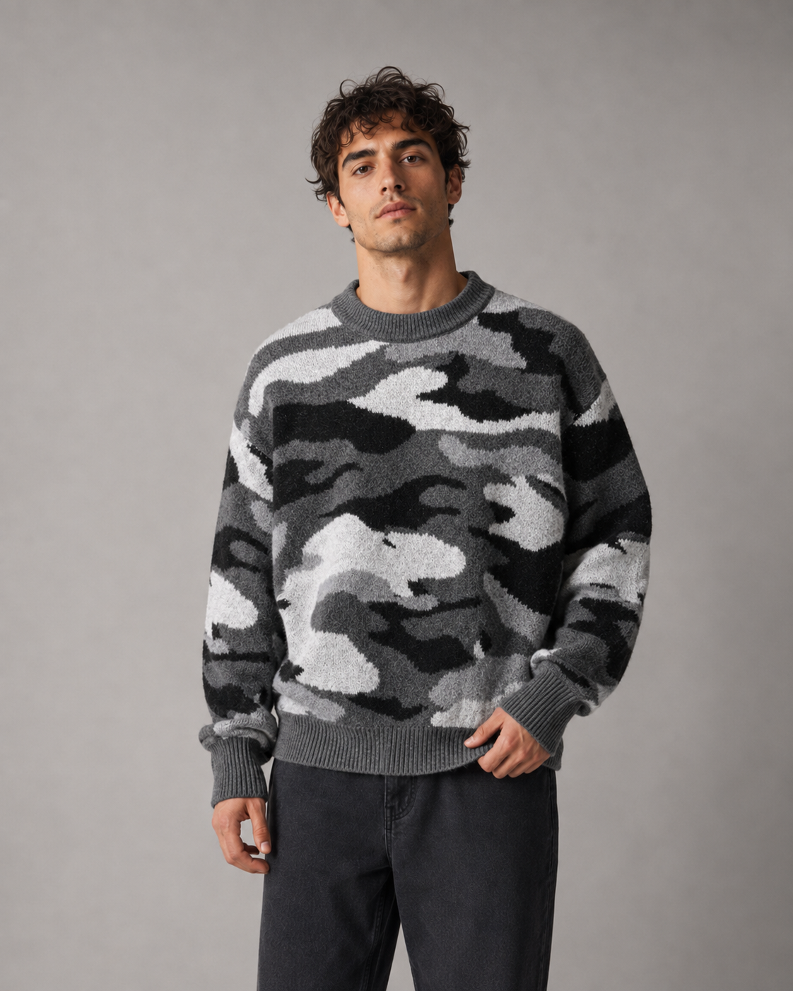Detail view of the crew neckline on a men's camo sweater