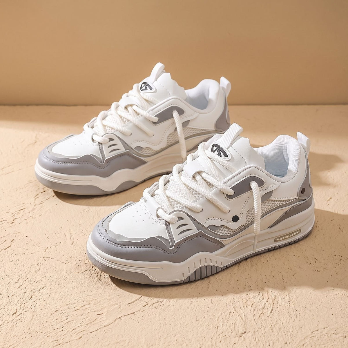 White and gray casual sneakers for men displayed as a pair