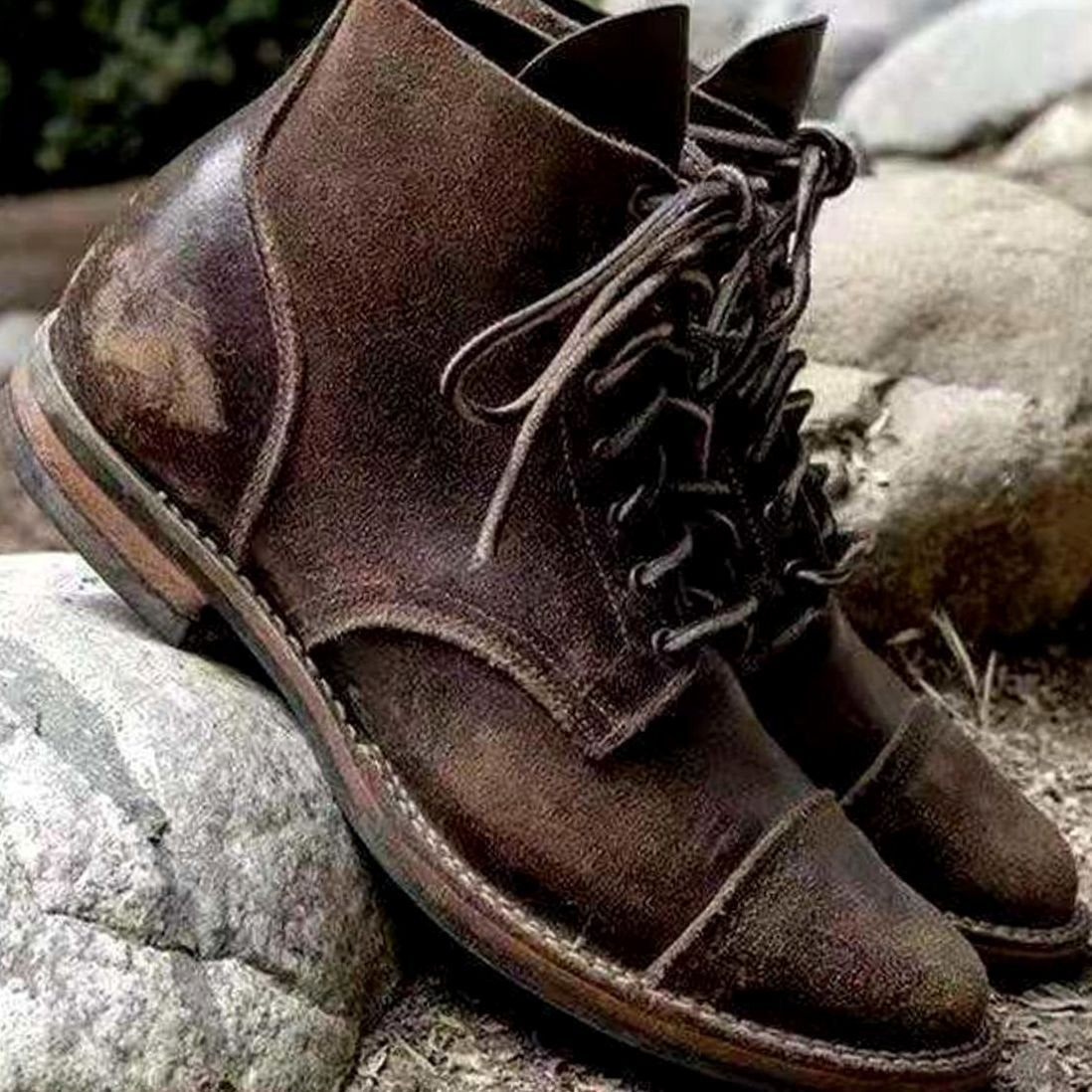 Close-up of the lace-up front on insulated men's ankle boots