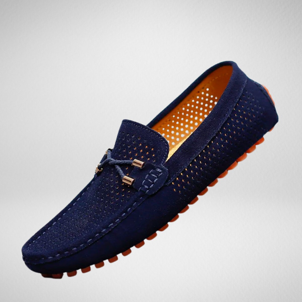 Men's perforated suede slip-on driving loafers shown from the side