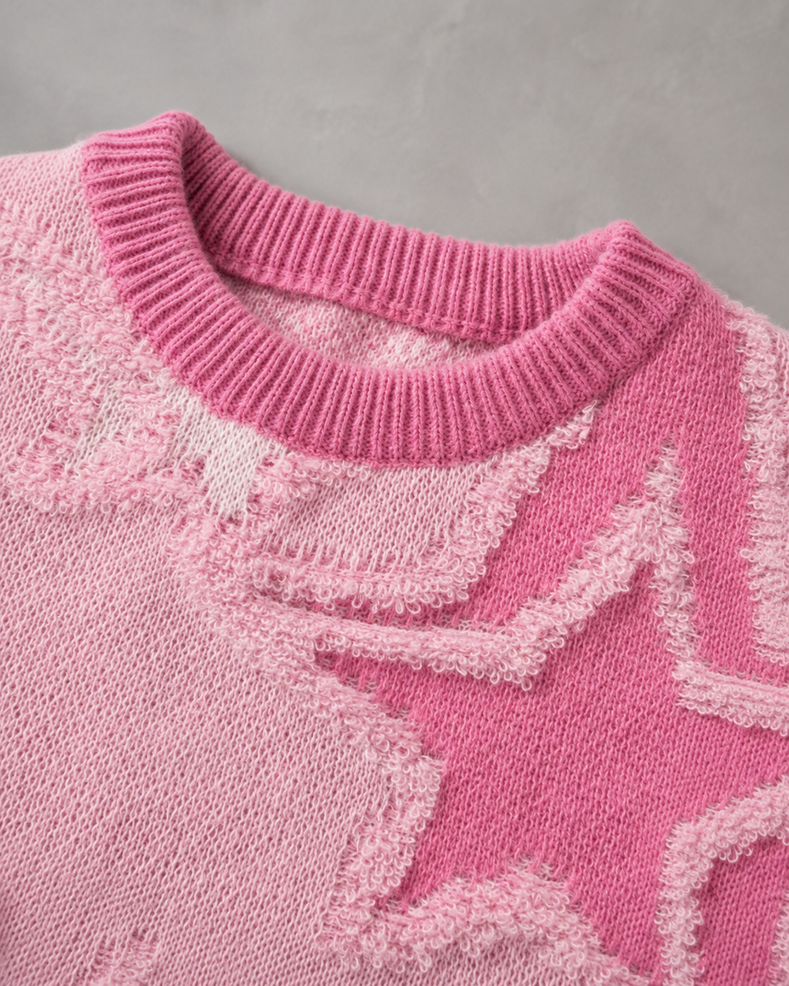Men's knit sweater shown with ribbed cuffs and hem