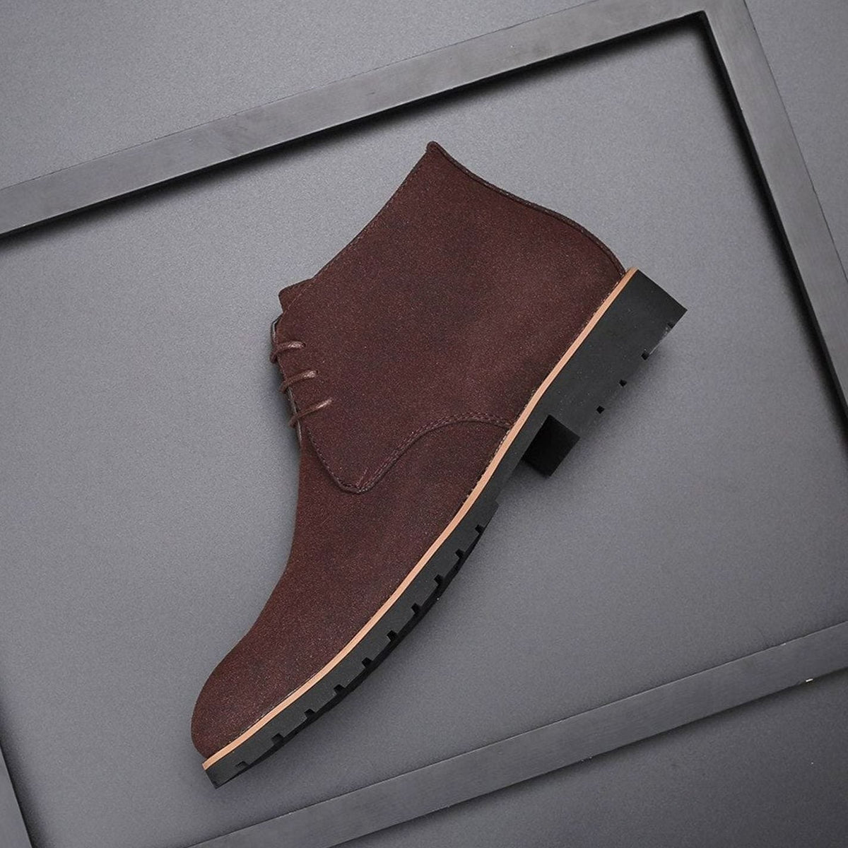 Pair of men's suede chukka boots styled for casual everyday wear