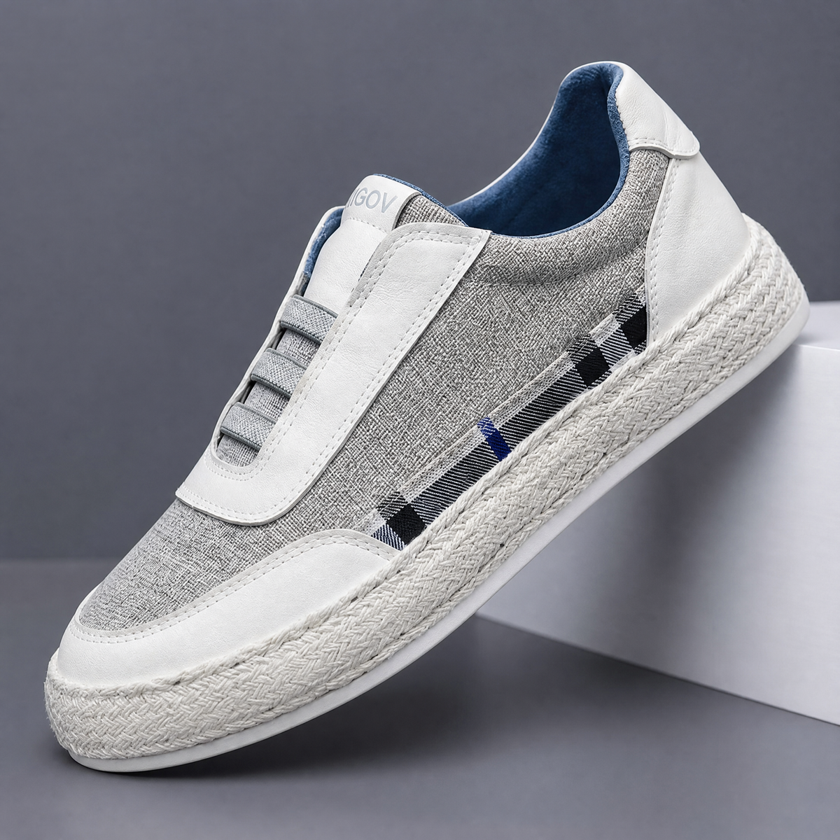 Woven linen espadrille sneakers with leather accents shown from the side