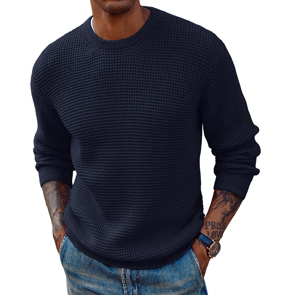 Close-up of the ribbed knit texture on a crew-neck longline sweater
