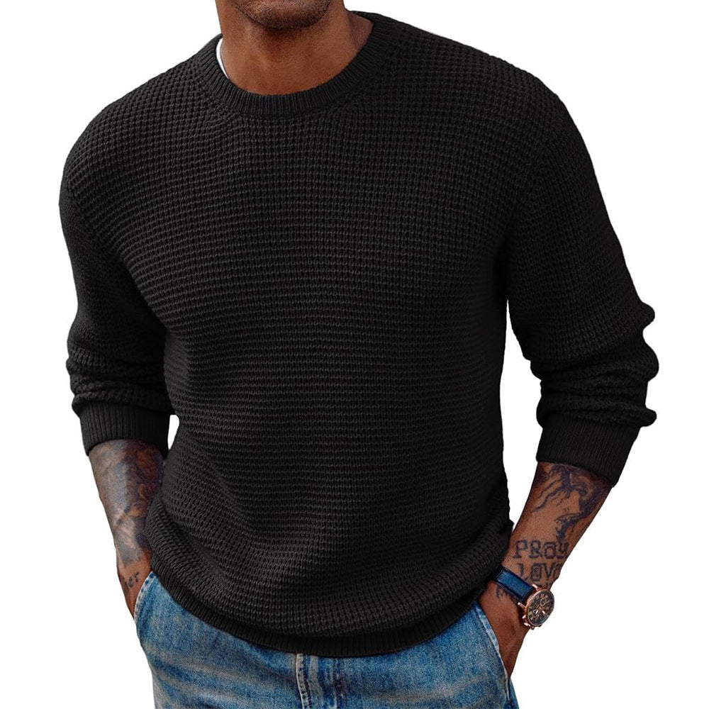 Side view showing the extended longline fit of the ribbed sweater